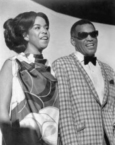 Della Beatrice Howard Robinson with Ray Charles.